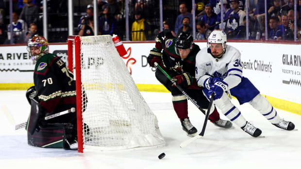 Auston Matthews skates behind the net
